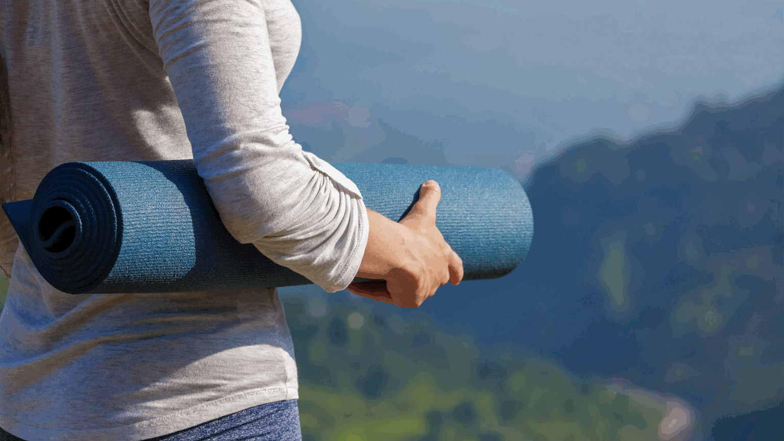 Woman with yoga mat